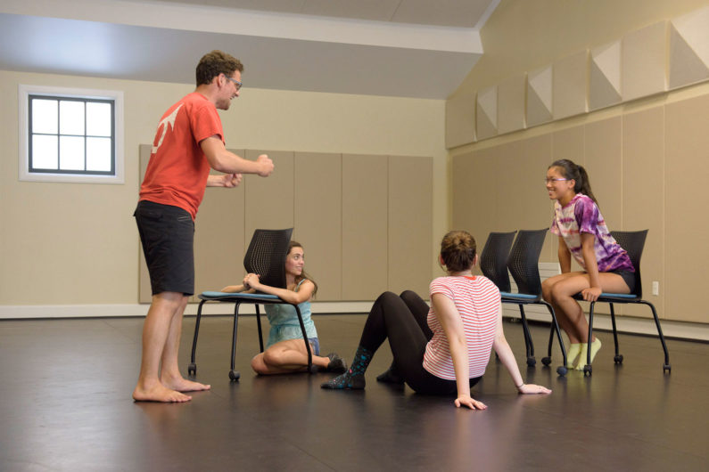 Drama instructor Felix Abidor and 3 students