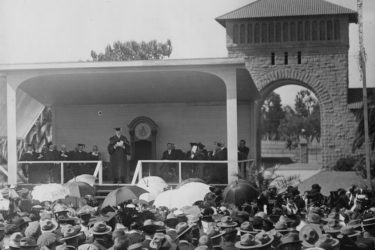 John C. Branner gives inaugural presidential address from a makeshift stage on the Inner Quad.