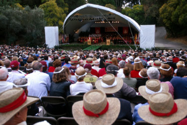 Alumni in the crowd for the inauguration of President John Hennessy at Frost Amphitheater were easily identified by their straw hats.