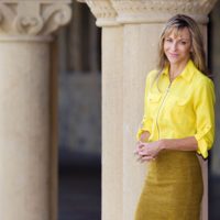 Beth Darnall stands in front of a column.