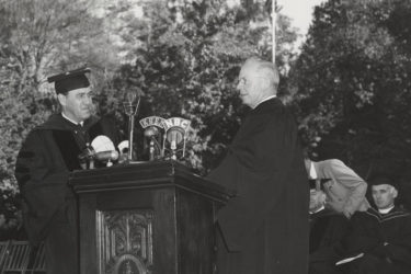 Wallace Sterling at the lectern with radio microphones to broadcast his inaugural address