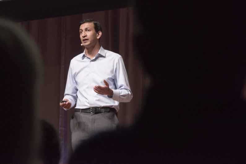 Raj Chetty, professor of economics, speaking on stage