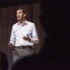 Raj Chetty, professor of economics, speaking on stage