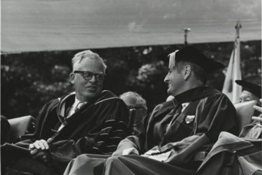 Kenneth Pitzer at his inauguration seated next to a university trusee