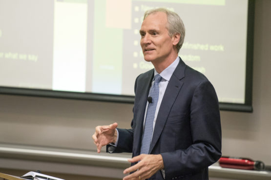 Marc Tessier-Lavigne standing in front of a screen displaying his PowerPoint slides.