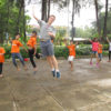 Sean Strong with children in Vietnam's Mekong Delta