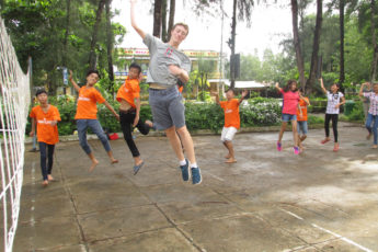 Sean Strong with children in Vietnam's Mekong Delta