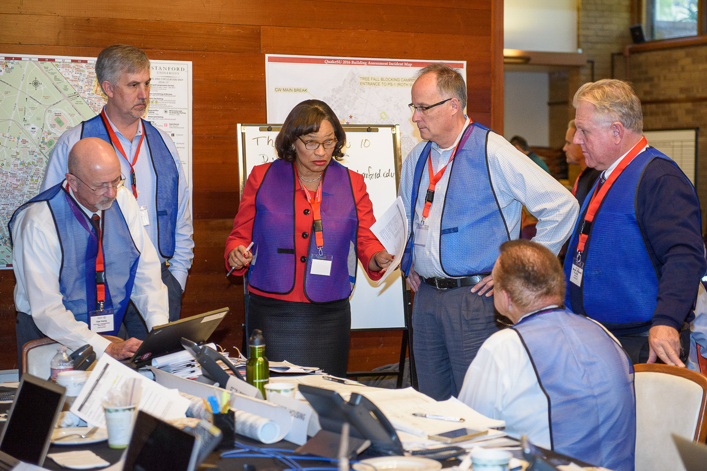 Senior associate vice provost Shirley Everett, center, speaks with other administrators at the QuakeSU 2016 exercise in the Emergency Operations Center.