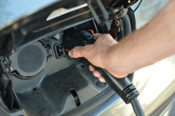 closeup of electric vehicle being charged