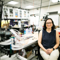 Allison Okamura sitting in her lab