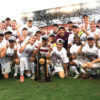 men's soccer team with NCAA trophy