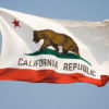 California flag flying with blue sky in background