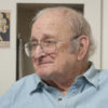 portrait of drama professor Carl Weber in his office