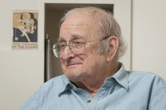 portrait of drama professor Carl Weber in his office