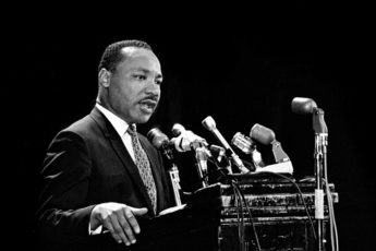 Martin Luther King Jr. at lectern in Stanford's Memorial Auditorium, April 14, 1967