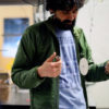 Manu Prakash with a spinning disc whirligig that can be used as a low-cost centrifuge