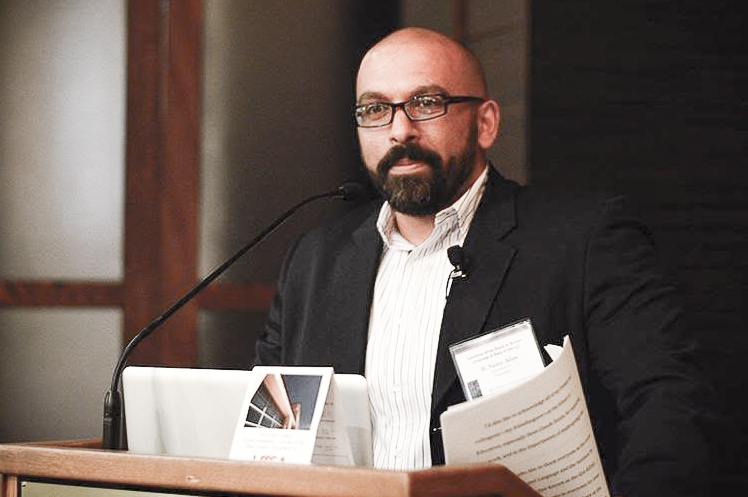 H. Samy Alim at a lectern speaking