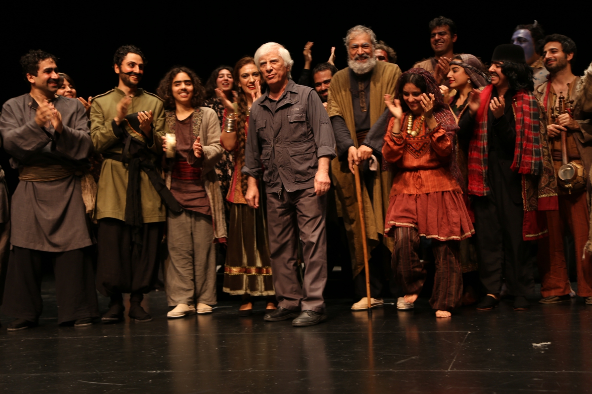 Director Bahram Beyzaie shares the stage with his actors after a Stanford performance of the Iranian play Tarabnameh. 