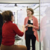 Research engineer Jennifer Hicks (facing) in discussion with Ilenia Battiato, assistant professor of energy resources engineering