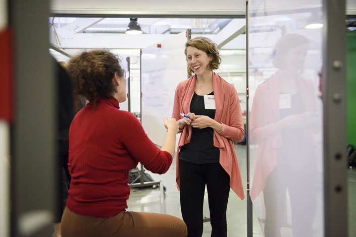 Research engineer Jennifer Hicks (facing) in discussion with Ilenia Battiato, assistant professor of energy resources engineering