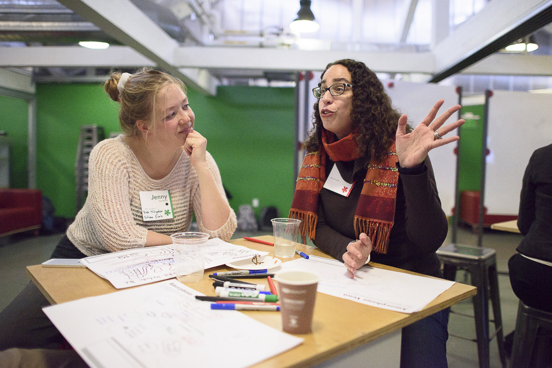 Jenny Suckale and Amalia Kessler in conversation at a desk during a Catalyst workshop at the d.school