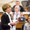 Pam Matson standing in front of the Faculty Senate.