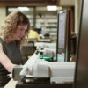 Anna Polishchuk translates documents from the original Russian at the Hoover Archives.