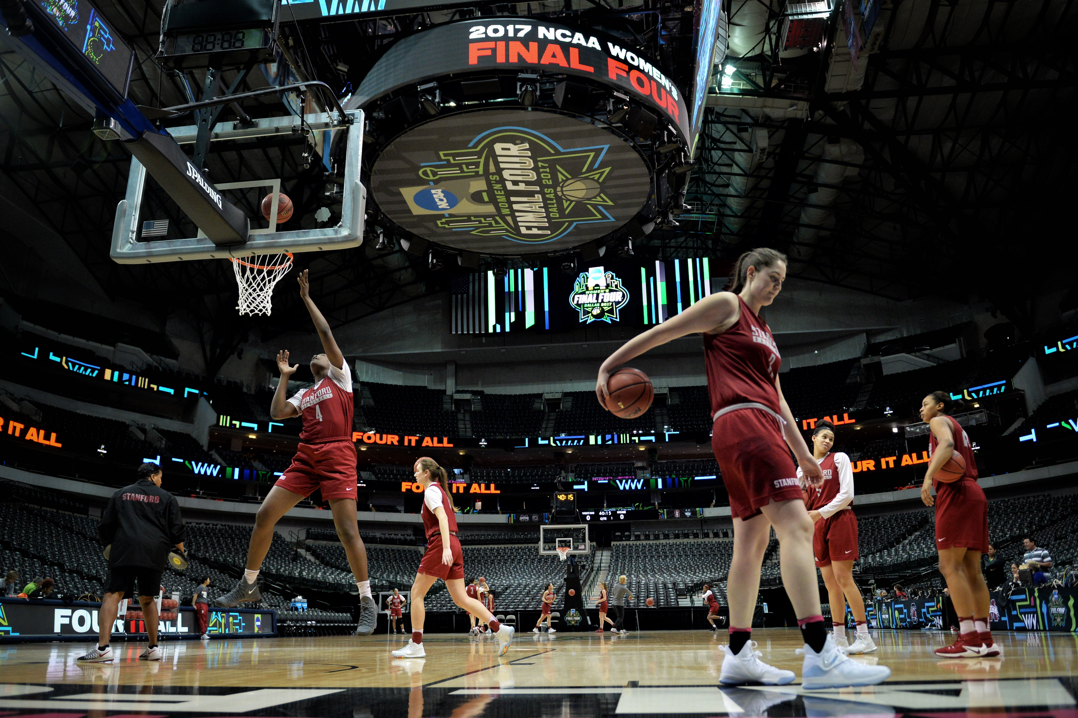 Basket ball players warming up on the court