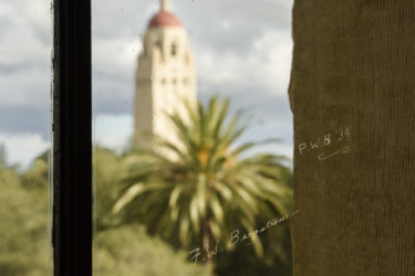 Window from Old Chemistry building shows student names etched in glass