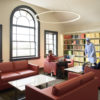 three students in a study area of the new Li & Ma Science Library