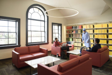 three students in a study area of the new Li & Ma Science Library