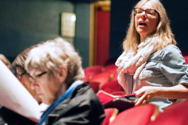 Director Amy Freed in the back of the theater