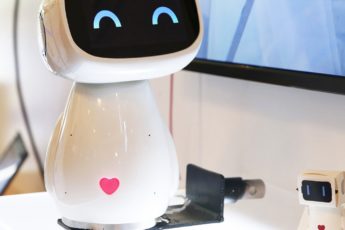 A cute robot with a heart on its belly.