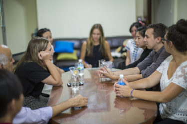 several people seated around a table