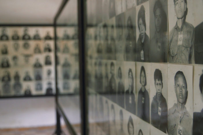 walls of photos of genocide victims)