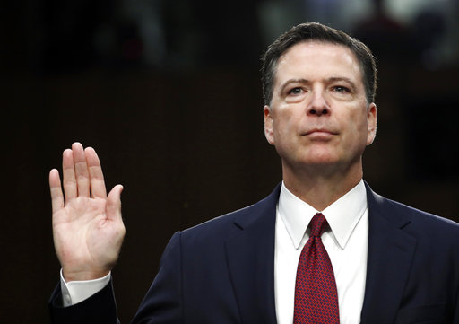 Former FBI Director James Comey is sworn in during the June 8 Senate Intelligence Committee hearing in Washington.