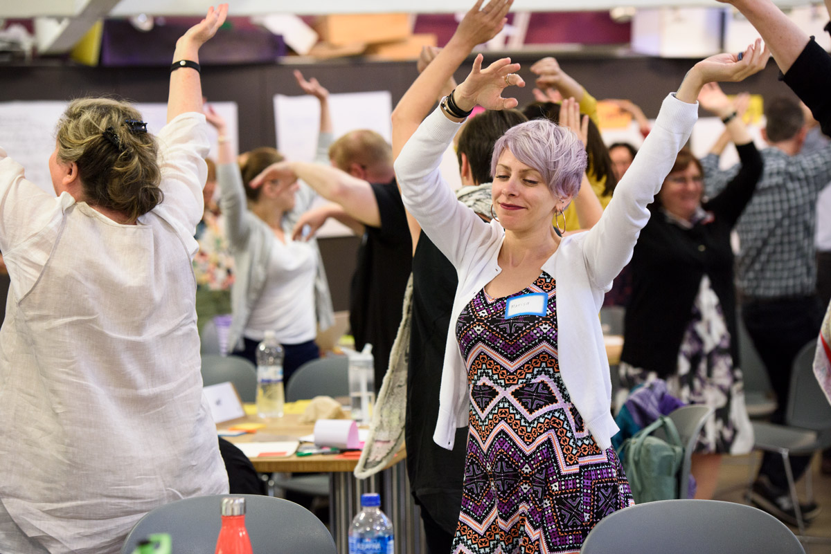 Marisa LoBianco of the New School loosens up with the class between exercises.