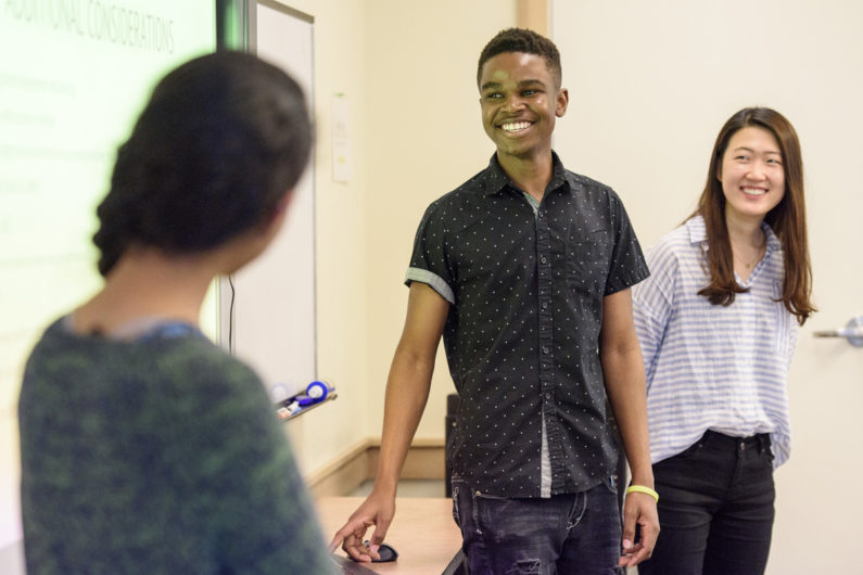 Helen Park, right, and Timothy Tatenda Mazai chat with Mayuka Sarukkai