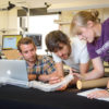 Graduate students Joseph Greer, left, and Laura Blumenschein, right, work with Elliot Hawkes, a visiting assistant professor