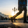 legs of a walker crossing th O'Connell Bridge in Dublin, Ireland