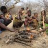 Members of the Hadza, a hunter-gatherer population in Tanzania, gathered around a fire.