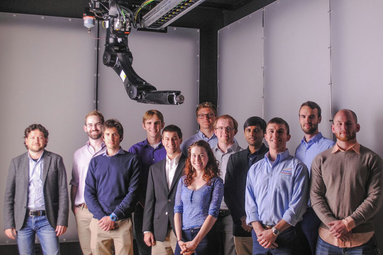 Members of Simone D'Amico's Space Rendezvous Laboratory inside the room where they test space navigation in highly realistic illumination conditions.