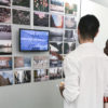 Artist Elliot Luscombe, ’09, discusses his work with a fellow alum at the opening of Stop. Motion. Stanford Artists Around New York at the Stanford in New York Center.