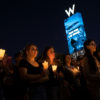 LAS VEGAS, NV - OCTOBER 2: Mourners attend a candlelight vigil at the corner of Sahara Avenue and Las Vegas Boulevard for the victims of Sunday night's mass shooting, October 2, 2017 in Las Vegas, Nevada. Late Sunday night, a lone gunman killed more than 50 people and injured more than 500 people after he opened fire on a large crowd at the Route 91 Harvest Festival, a three-day country music festival. The massacre is one of the deadliest mass shooting events in U.S. history.