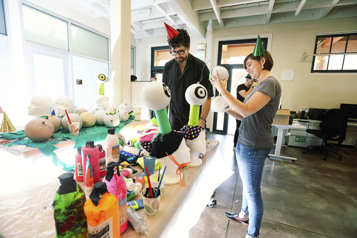 Machine Dazzle and PhD student Lily Lamboy build props in Roble Arts Gym.