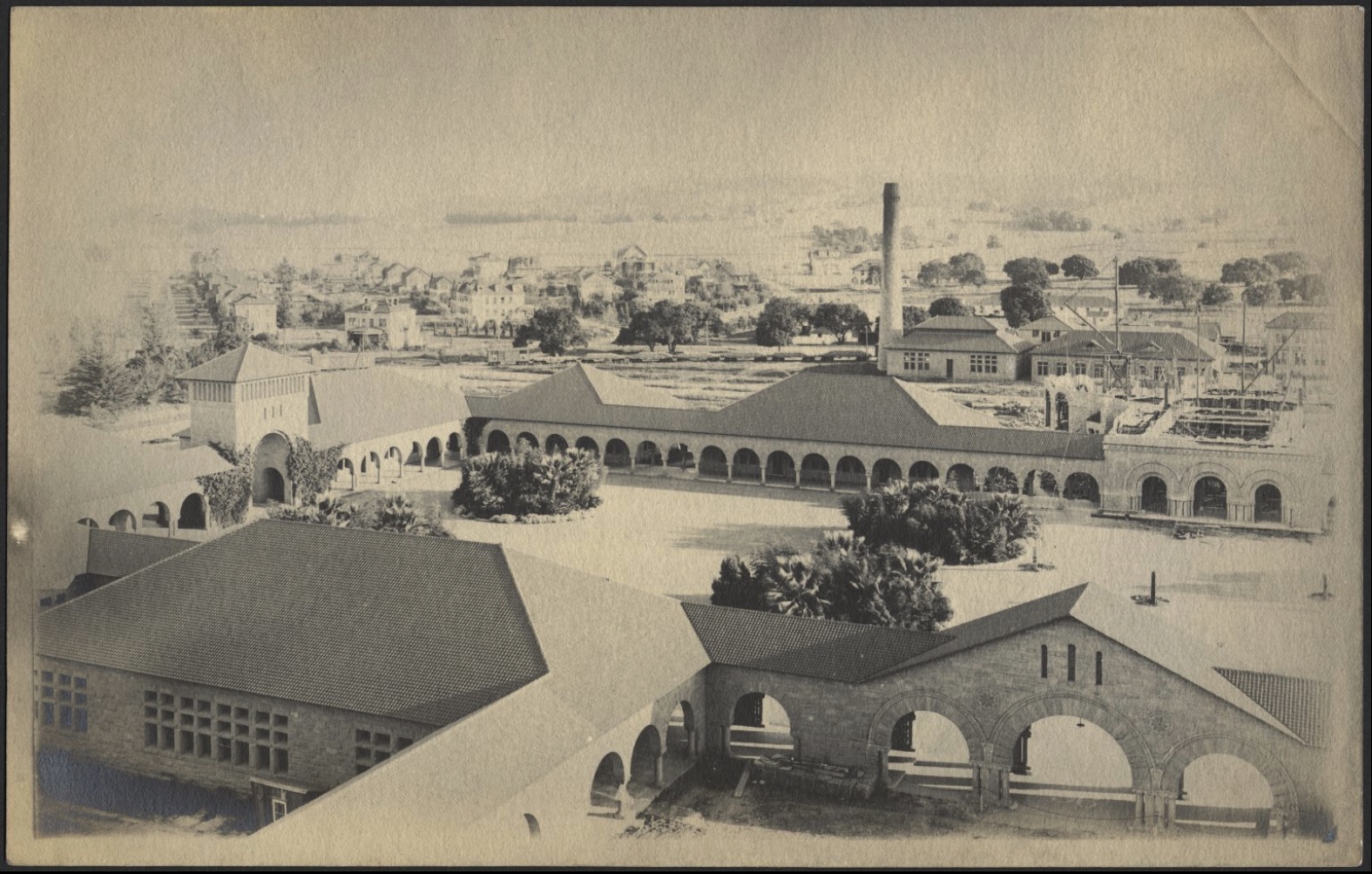 A photo from the 1890s shows the power house, which is the building with the chimney, where Julius Andrew Quelle, then Stanford student, set up his printing shop initially.