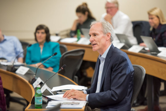 Marc Tessier-Lavigne seated in the senate meeting.