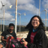 In 2017, Celine Wang, a Stanford undergraduate, helped create and install affordable remote monitoring systems for small-scale power plants on the Indonesian island of Sumba, under an Engineering in Service International Fellowship awarded by the university. She is pictured at the Palindi Wind Turbine farm with Mas Petu, a supervisor with IBEKA, the Indonesian non-governmental organization devoted to improving the living standards of rural communities – including through electrification projects using renewable energy.