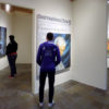 Visitors view the exhibition Xiaoze Xie: Confrontation and Disruption on view at the Art Gallery in Stanford in Washington’s Sant Building.