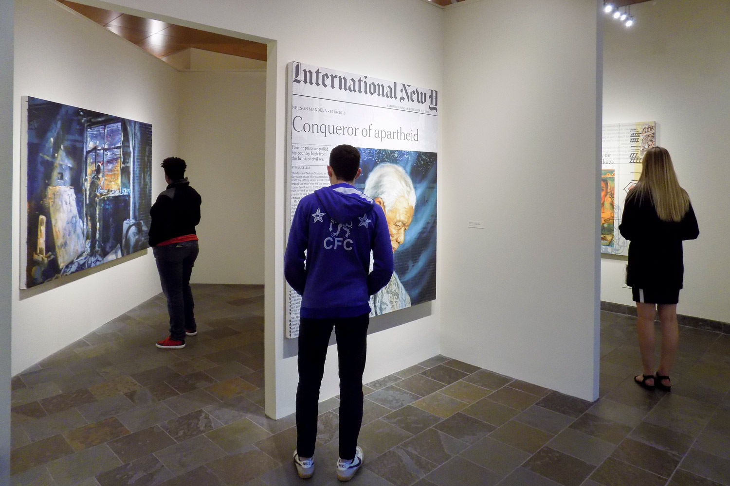 Visitors view the exhibition Xiaoze Xie: Confrontation and Disruption on view at the Art Gallery in Stanford in Washington’s Sant Building.